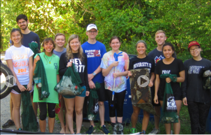 Group of students picking up litter