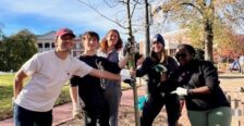 Students posing after they've planted a tree